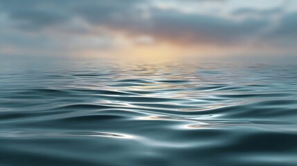 Obraz premium Soft gradient sky meeting a calm rippling water surface at dawn or dusk creating an ethereal coastal backdrop