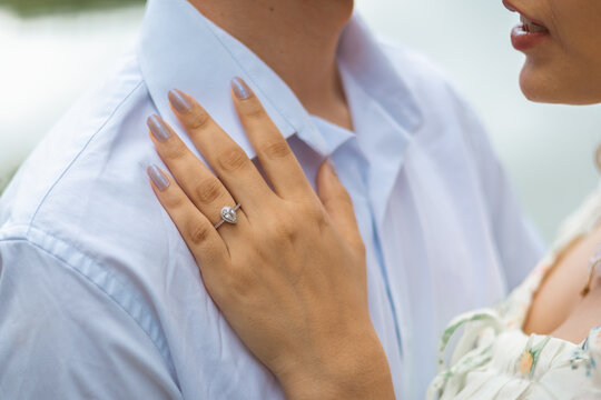 Close up of engagement ring on woman's hand