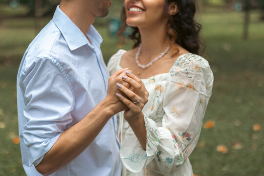 Close up of couple holding hands romantically