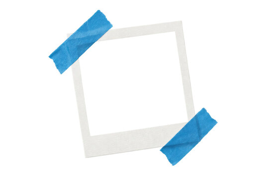 Blank square polaroid photo frame taped to a surface with blue masking tape isolated on white