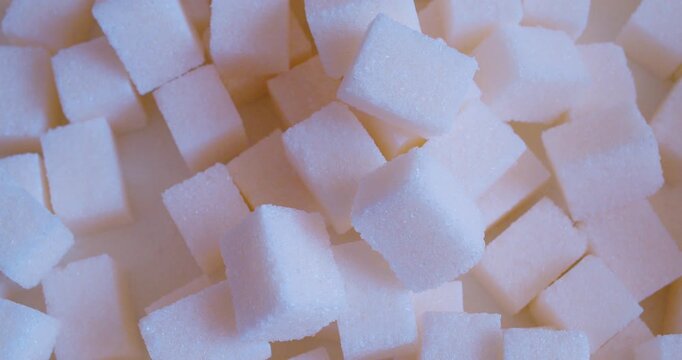 A macro shot of a pile of sugar cubes.Food background. The soft natural light.