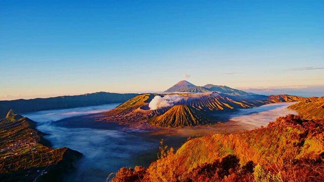 Scenic panorama of the Bromo Tengger Semeru National Park showcasing rugged terrain and atmospheric fog.