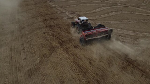 Tractor Sowing Seeds in Dry Field - Agricultural Planting Process