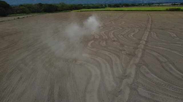 Tractor Sowing Seeds in Dry Field - Agricultural Planting Process