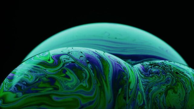 Abstract swirling neon wave pattern in dark teal and green on black background
