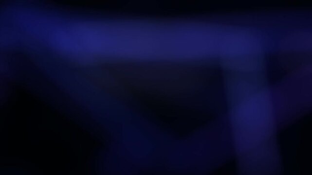 Abstract blue ink swirls and particles in dark fluid motion background