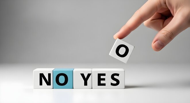 Hand removing the letter O from NO to form YES blocks change