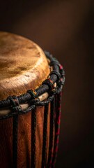 African djembe drum showing textured hide surface and ropes