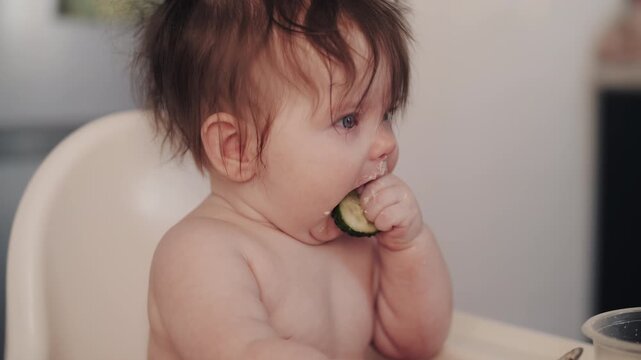 Baby Girl Trying Cucumber First Solid Food Baby Led Weaning at Home