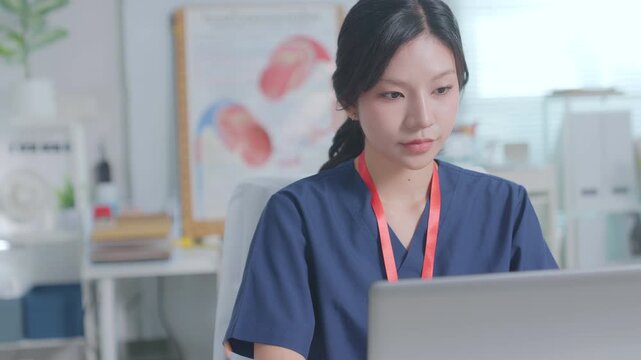 Doctor entering electronic medical records. Medical, asian woman working with computer in medical consultation at hospital. Healthcare and medicine. Physician diagnosis and treatment plan.