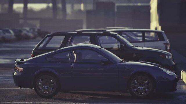 Sport coupe parked beside suvs, low sun casting long shadows, juxtaposition of compact coupe and taller SUVs, alloy rims and layered silhouettes, quiet lot