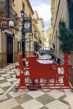 Walking along ancient streets enjoying historic architecture and charming atmosphere in Ronda, Spain.