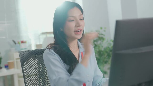 Young happy business woman having remote online work meeting or job interview. Young female employee looking at screen computer during virtual video conference call in office. brainstorming seminar.