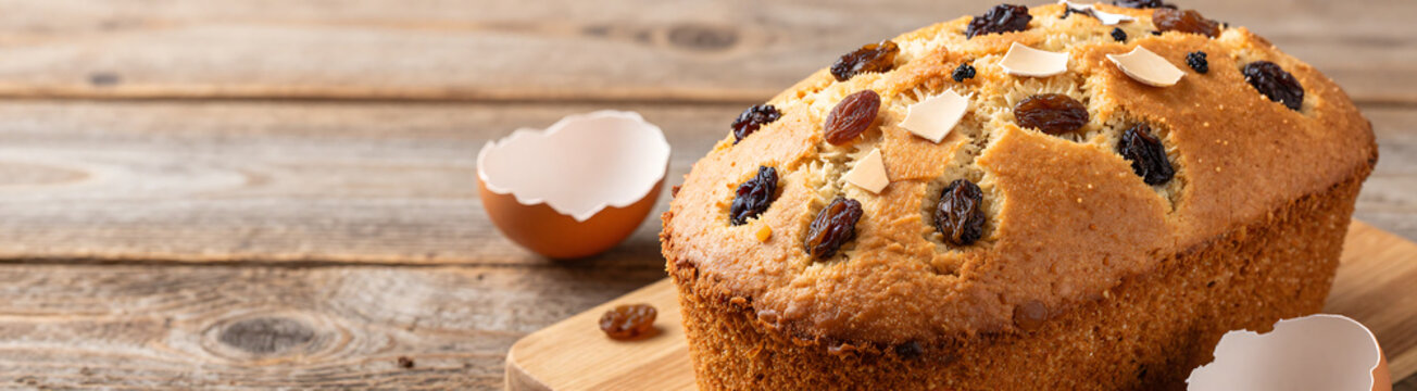 classic easter dessert featuring cake plump raisins intricately decorated eggshell fragments set warm