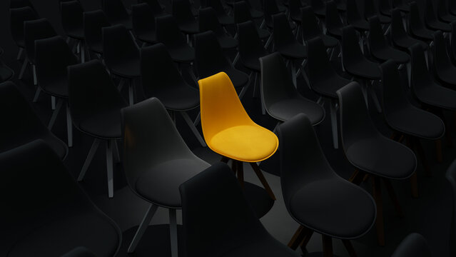 Angle view of Single Bright Yellow Chair Among Rows of Dark Grey Seats.