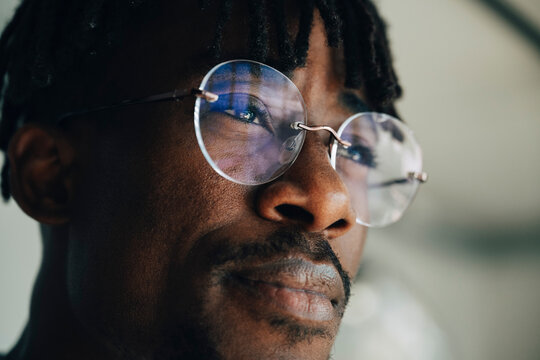 Focused entrepreneur looking thoughtfully at office