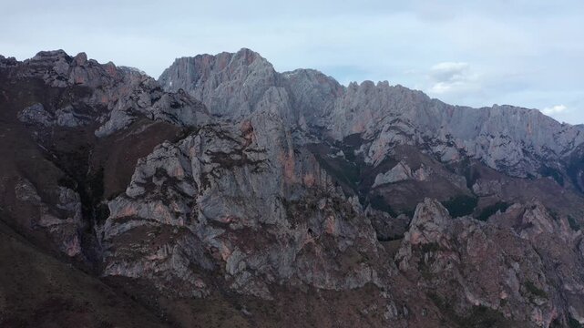 Dramatic Rocky Mountain Range Under Cloudy Sky