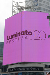 Naklejka premium digital advertisement for Luminato Festival at Sankofa Square, Dundas St W and Yonge St, Toronto