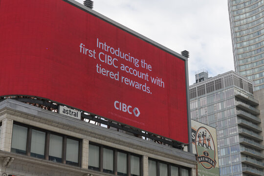 rooftop digital advertising for CIBC (Canadian Imperial Bank of Commerce) at 279-283 Yonge Street, a historical building designed by J.C. Westervelt, 1918, Toronto