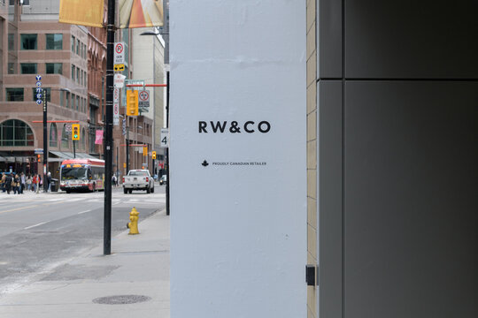 RW&CO sign with defocused view south on Yonge St outside CF Toronto Eaton Centre, 220 Yonge St, Toronto
