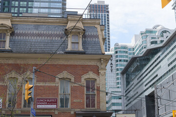 Naklejka premium exterior of historic building (William Barber Building, 1880) and sign (Aroma Fine Indian Cuisine) - east elevation - 287-289 KIng St W, Toronto