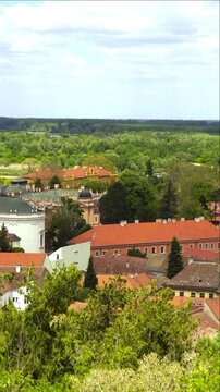 Aerial view of Sremski Karlovci historic center with the Patriarchate palace and baroque church towers. Illustrates Austro-Hungarian urban legacy, religious heritage architecture, and cultural tourism