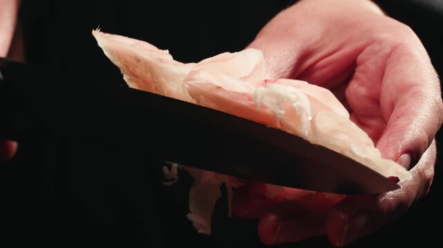 Raw lamb sheep fat tail fat on wooden board, close up of middle eastern pork or lamb dish. Rotating macro meat. 