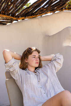 teen girl relaxing in shade, Botswana, Africa