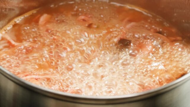 Slavic meat soup, Solyanka sausages soup with sour cream white bowl food, close up of winter soup with ham
