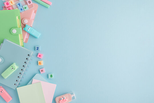 Pastel school supplies flat lay on light blue background