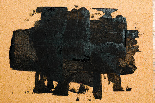 Black Acrylic Paint Brushstroke on Cork Texture Background