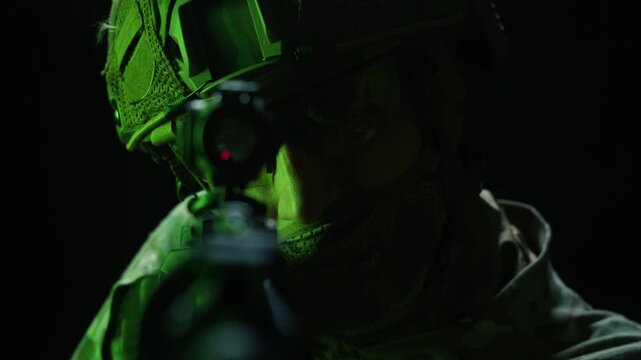 Portrait of modern soldier in military uniform and a helmet with headphones rifle, army warrior Warrior Military Gear Ready for Battle, airsoft Players in Tactical Gear and Riot Police Training