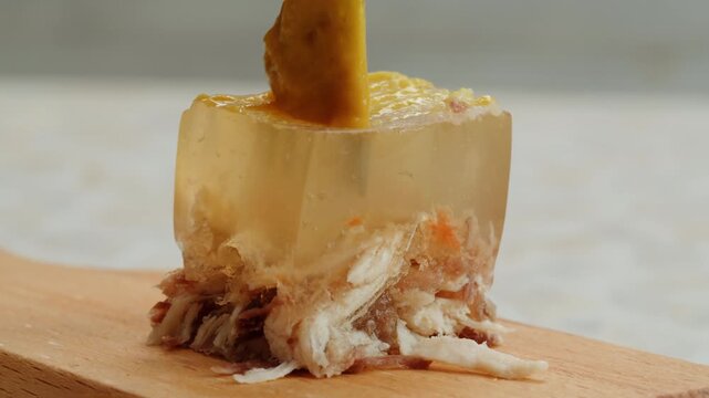 Meat aspic, slavic food, Traditional Russian pork meat aspic Kholodets with horseradish, mustard, jellied jelly beef, eating in restaurant chicken tasty dish. Close up on kitchen. 