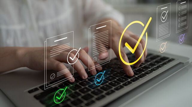 A focused user operates a laptop to manage digital workflows, showcasing checkmarks indicating completed tasks and promoting efficiency in a modern office setup. Cyphers