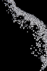 Fototapeta premium Beautiful pearls on black background. Luxury abstract composition with glossy pearl beads, minimal design, elegance and copy space