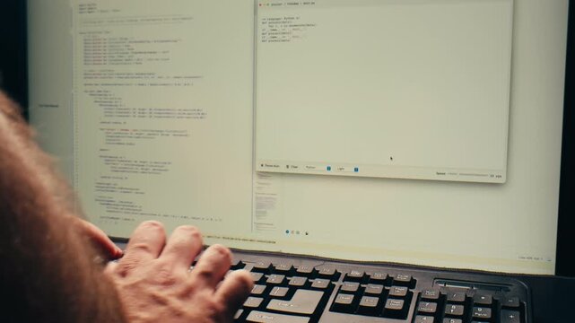 Man work with chatbot AI online, connecting with AI and using a chat bot. IT engineer software developer programmer interact with chat bot, making writing code. Typing on laptop keyboard