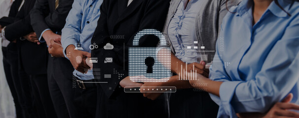 A group of professional individuals stands united in a corporate setting, embodying security and teamwork with a digital padlock symbolizing the importance of cybersecurity. Trope © InfiniteFlow