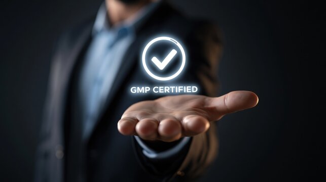 A businessman in a suit holds out his hand, displaying a glowing "GMP CERTIFIED" icon with a checkmark.