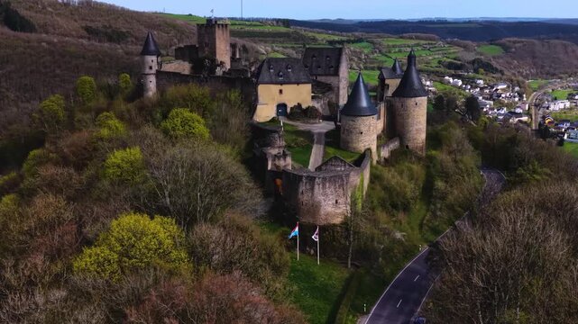 A panoramic Aerial view of the city and castle Clervaux in Luxembourg, on a sunny spring noon