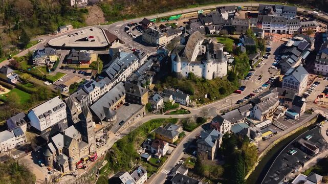 A panoramic Aerial view of the city and castle Clervaux in Luxembourg, on a sunny spring noon