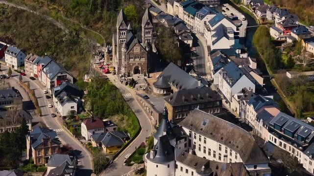 A panoramic Aerial view of the city and castle Clervaux in Luxembourg, on a sunny spring noon