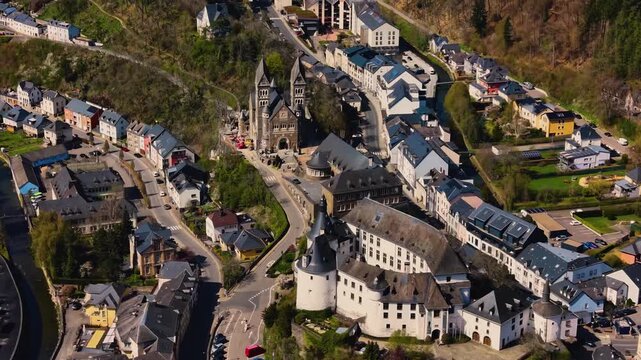 A panoramic Aerial view of the city and castle Clervaux in Luxembourg, on a sunny spring noon