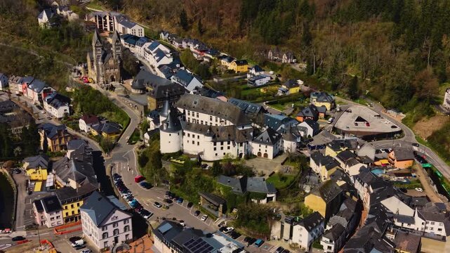 A panoramic Aerial view of the city and castle Clervaux in Luxembourg, on a sunny spring noon