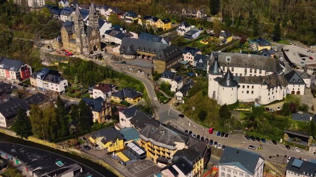 A panoramic Aerial view of the city and castle Clervaux in Luxembourg, on a sunny spring noon