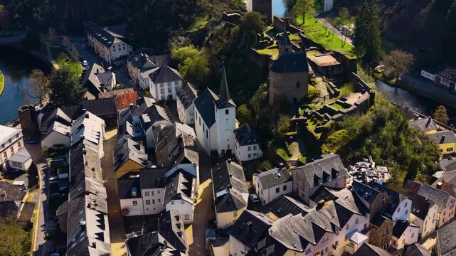 A panoramic Aerial view of the city and castle Clervaux in Luxembourg, on a sunny spring noon