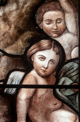 Naklejka premium Stained glass (19th century) of portraits of angels in heaven.