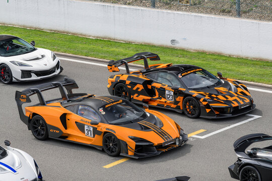 Stavelot, Belgium - April 5th 2026 : View on two McLaren Senna driving on a street with other sports cars around.