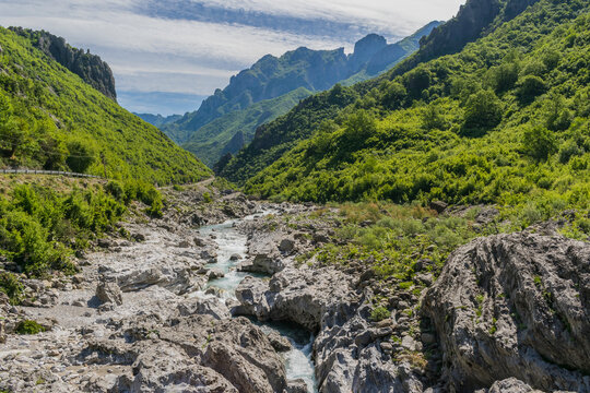 Turquoise Kiri River near Prekal, Shkoder, Albania, with clear water, rocky cliffs and natural mountain landscape in the Albanian Alps.