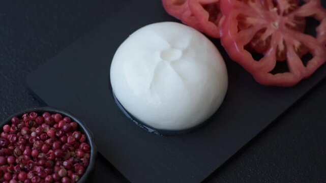 Fresh white burrata cheese with tomatoes for a salad. Burrata cheese as a food background for your design
