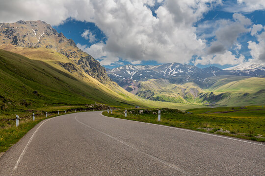 Road to the Dzhily Su against the backdrop of Caucasus mountains